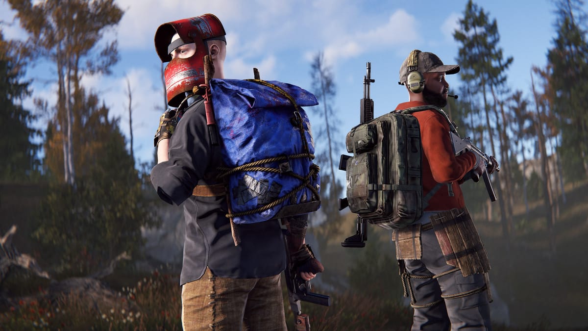 Two armed players with backpacks walking through a pine forest in Rust